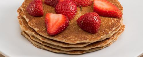 Gluten Free Pancakes · House gluten free pancake mix topped with strawberries.