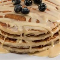 Blueberry Lemon Pancakes · Multi-grain protein pancakes with blueberries and lemon zest topped with white chocolate pro...