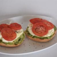 Fit Bagel · Wheat bagel topped with avocado, egg whites, tomatoes, salt, pepper and olive oil.
