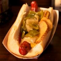 Italian Dog · Fried peppers & onions, potatoes, spicy mustard and ketchup all on a hoagie roll.