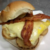 Breakfast Sandwich · 2 eggs, cheese, bacon and sliced potatoes.