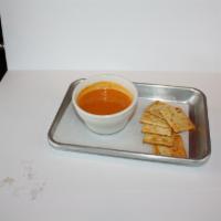 Tomato soup · Bowl of creamy tomato soup.