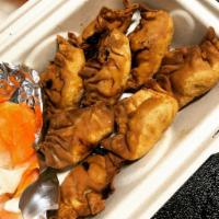 A10. Fried Wonton · Wheat flour shell, vermicelli, pork, carrot, taro, onions, served with home-made pickles and...