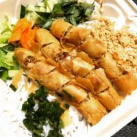 VE2. Vegan Spring Roll Vermicelli · Lettuce, beansprout, pickles, cucumber, peanut, onions, served with our home-made soy sauce....