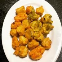 VA5. Vegetables Tempura  · Eggplant, carrot, taro and broccoli, tempura powder, served with our home-made garlic sauce....