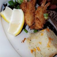 Coconut Crusted Shrimp Dinner · 6 pieces jumbo shrimp hand battered and crusted. Served with a sweet mango chili dipping sau...