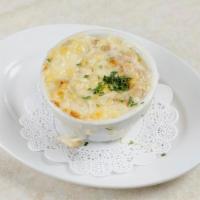 French Onion  Soup · Crispy swiss cheese and croutons  