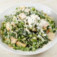 Kale Caesar Salad · DRESSING COMES ON THE SIDE

Kale, Romaine, crouton crumbs, and Parmesan. 