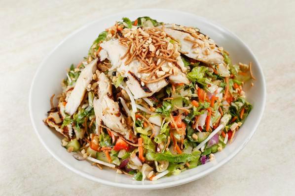 Asian Chicken Salad · DRESSING COMES ON THE SIDE

Grilled chicken breast, Romaine, cabbage, bean sprouts, cucumbers, carrots, red onions, red bell peppers, crispy rice noodles, peanuts, fresh herb mix, and Asian dressing.  