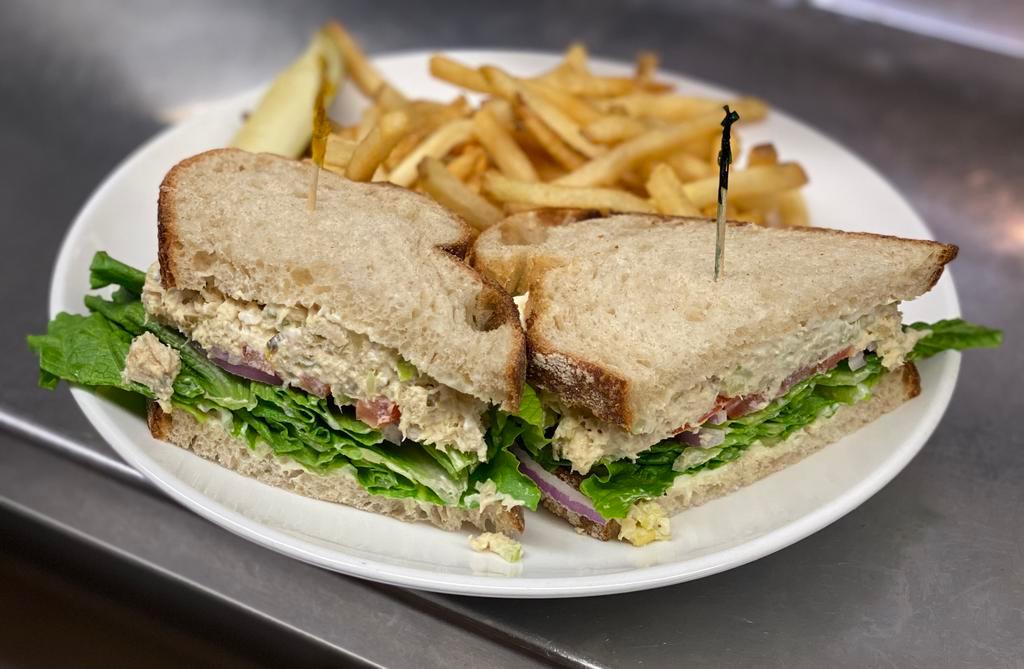 Albacore Tuna Salad Sandwich · Albacore Tuna Salad, Lettuce, tomatoes, red onions, and mayo served on whole wheat toast. Served with French fries and pickle wedge. 