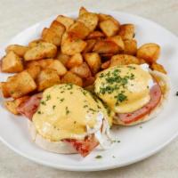 Eggs Benedict (Classic) · Grilled smoked pit ham. Served with two poached eggs, hollandaise sauce on toasted English m...