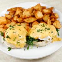 Florentine Benedict · Grilled tomatoes and spinach. Served with two poached eggs, Hollandaise sauce on toasted Eng...