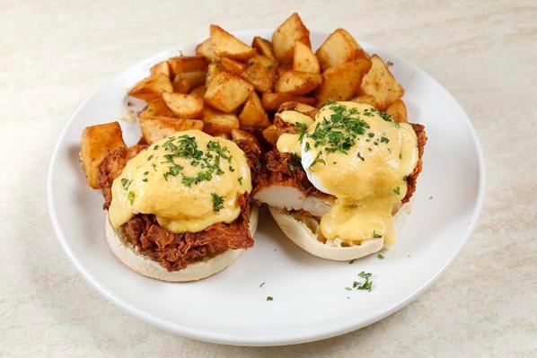 Fried Chicken Benedict · Served with two poached eggs, hollandaise sauce on toasted English muffin with rosemary garlic potatoes.  