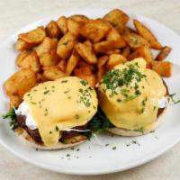 Crab Cakes Florentine · Grilled spinach. Served with two poached eggs, hollandaise sauce on toasted English muffin w...
