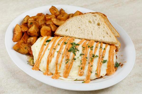 Bourbon St Omelette · Three Eggs, Pepper Jack Cheese, Spicy Sausage, Spinach, Bell Peppers, Onions, Mushrooms & Tomatoes Topped with Cajun Aioli

Served with choice of  Toast & Side