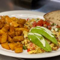 Don Moi Scrambler · Eggs, Chorizo, Onions, Bell Peppers, Pepper Jack Cheese Topped with Avocado, salsa Fresca & ...