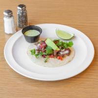 Steak Taco · Soft tortilla with grilled steak, avocado, pico de gallo, cilantro and lime wedge. Served wi...