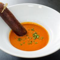 -Bowl of Soul · Rich & thick tomato soup served with a cheddar pretzel breadstick.