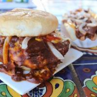 Double Chili and Cheeseburger · Two 100% beef patties, each with a slice of American cheese, served on a grilled bun with ma...