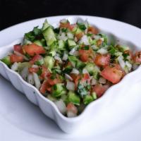 Shirazi Salad · Refreshing diced tomato, onion, cucumbers and mint with olive oil and lemon juice dressing