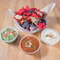 Tres Amigos · House made tri-colored chips served with fire roasted salsa, house guacamole, and our famous...