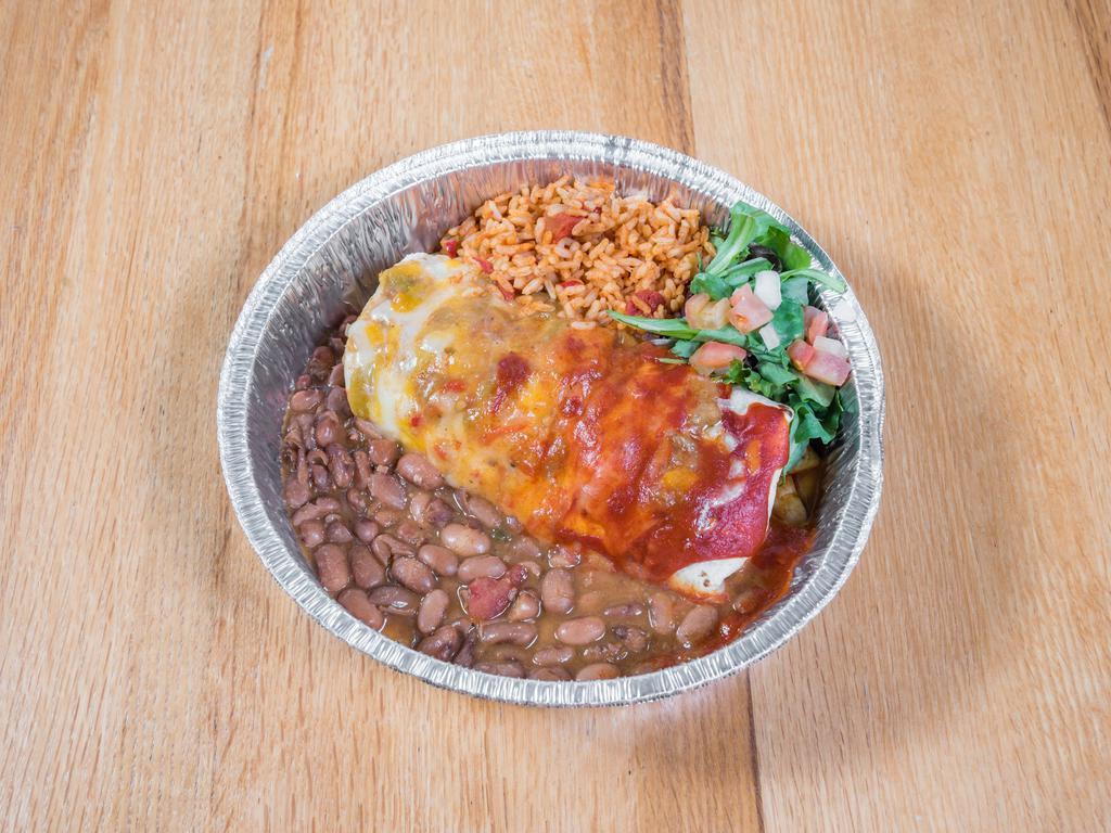 San Felipe Burrito · Choice of slow-cooked shredded beef, chicken, or calabacitas. Served with rice and pinto beans. Smothered in your choice of green chile or red chile sauce.