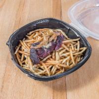 Steak Frites · Flat Iron steak over a tower of shoestring fries, caramelized onions, chimichurri butter, re...
