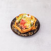 Taco Salad · Crispy Shell Filled with Pinto Beans, Spanish Rice, Romaine Lettuce, Jack & Cheddar Cheese, ...