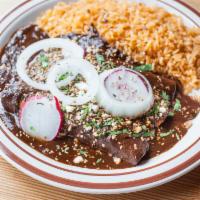 Mole Poblano Enchiladas · Two Grilled Chicken Breast Enchiladas. Smothered in Scratch made Mole, Queso Fresco, Spanish...