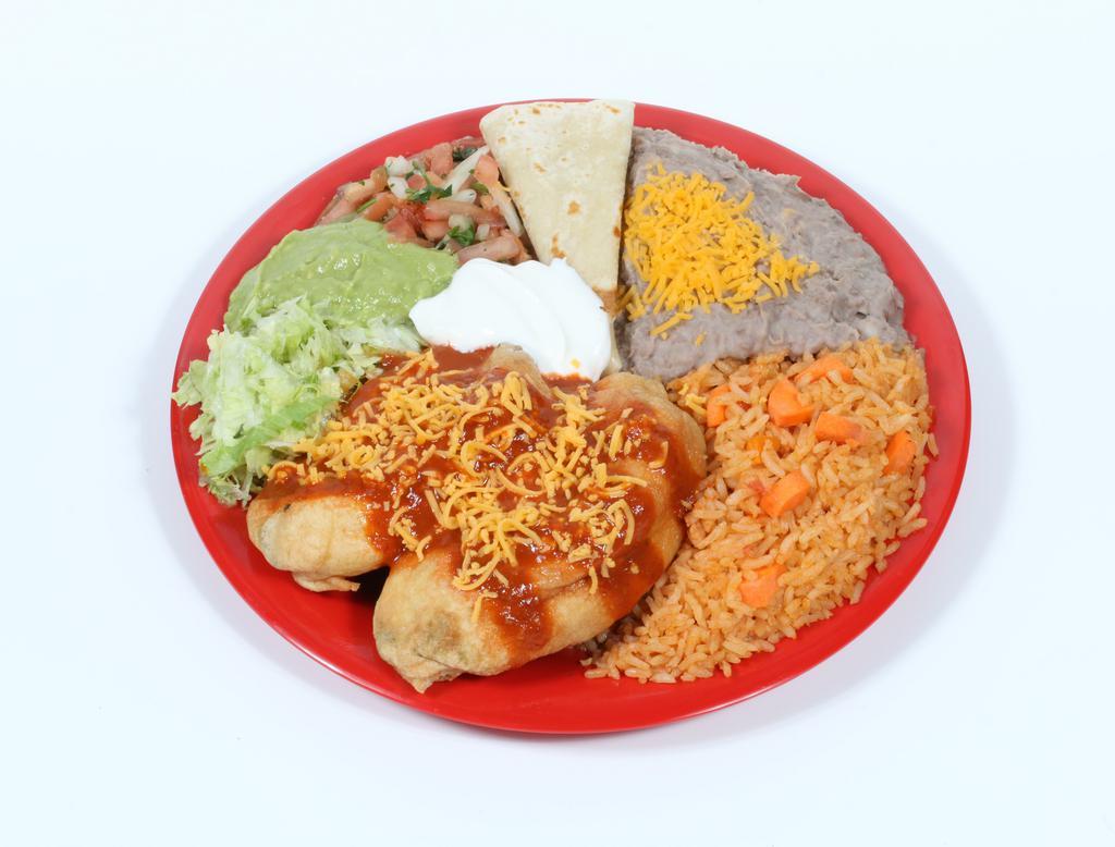 #15. Two Chiles Rellenos Combination · Two chile rellenos with enchilada sauce on top, lettuce, pico de gallo, guacamole and sour cream. Rice and beans with cheese on the side. Comes with tortillas.