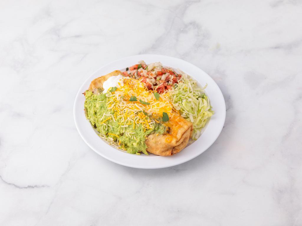 Special #4. Chimichanga · Your choice of shredded chicken, or ground beef, or shredded beef cooked with veggies. Beans and cheese inside. With guacamole, sour cream, and cheese on top. Lettuce and Pico de Gallo on the side. (Pictured with beans and rice on the side as well +$2.99)