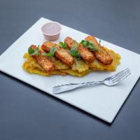 Golden Plantain Chips with Fried Cheese · Thinly sliced plantains fried until golden, alongside sticks of fried Dominican cheese. Serv...