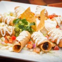 4 Flautas · Crispy tacos filled with chicken or potato and Mexican sausage.