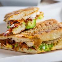 Avocado Chicken Panini · Grilled Chicken, sliced avocado, bacon, tomatoes and chipotle mayo.