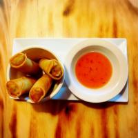 Spring Rolls · Marinated mixed vegetables wrapped in egg roll wrappers, deep-fried, and served with sweet a...