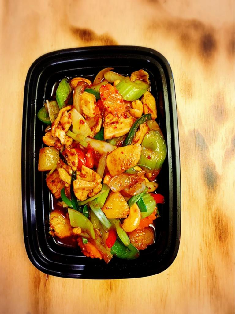 Pad Cashew Nut Chicken · Roasted cashew nut sauteed with white onion, carrot, green onion, bell peppers, pineapple, and celery with chicken in Thai chili paste sauce.