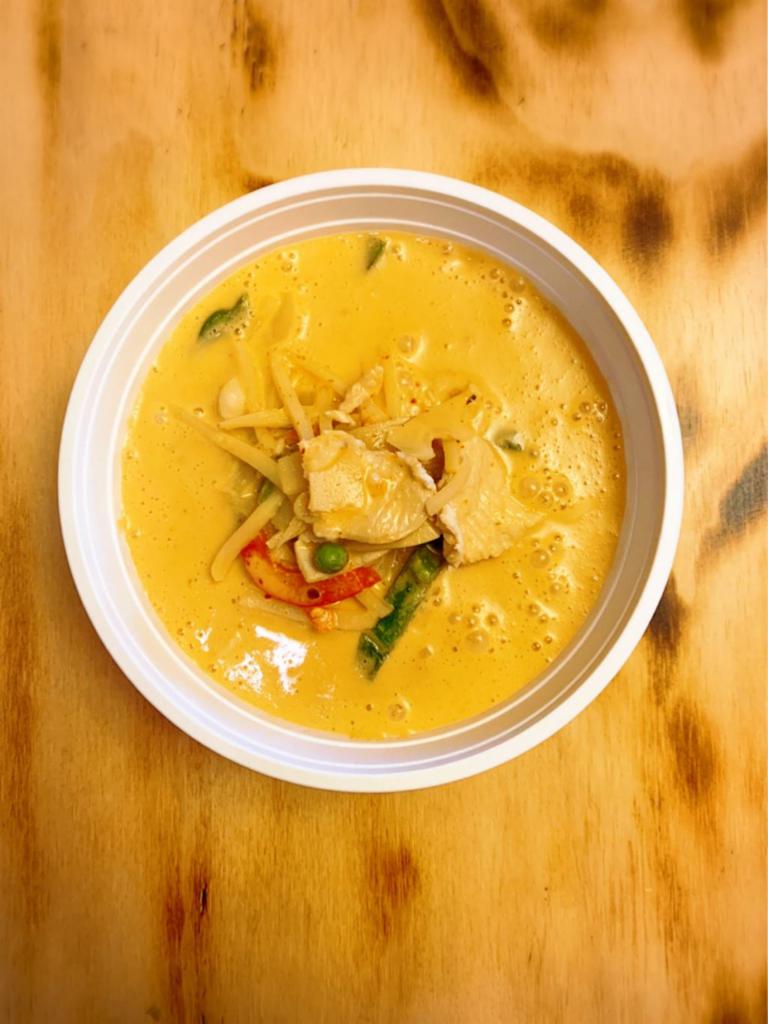 Chicken Red Curry · Thai gourmet red curry paste, sauteed with Thai coconut milk, chicken, bamboo shoots, bell peppers, and basil leaves.