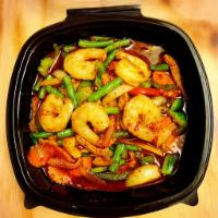 Goong Prik Pow · Stir-fried shrimps with a house special sauce, bell pepper, onions, green beans, and carrot....