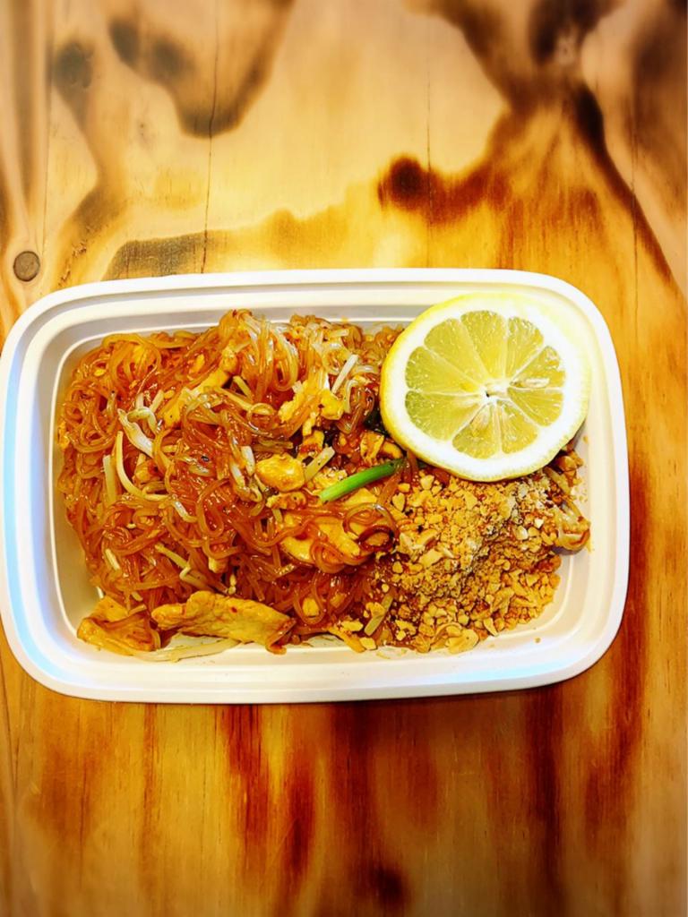 Pad Thai Chicken · (Most famous noodle dish in Thailand). Gourmet Thai rice noodles sauteed with chicken, bean sprouts, egg and topped with roasted ground peanut.