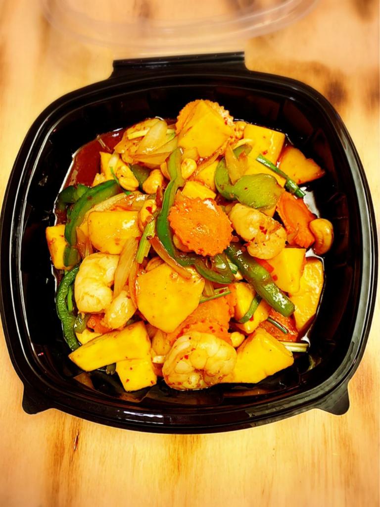Mango Cashew Delight · Stir-fried fresh mango with shrimps, cashew nuts, carrot, and bell pepper in Thai chili paste.