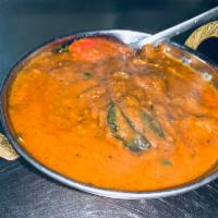 Lamb Madras · Cooked in spicy aromatic sauce with chili and tomatoes.