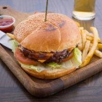 Zad Burger · 10 oz. of grilled prime veal meat, tomatoes, lettuce, onions in a bun. Served with french fr...