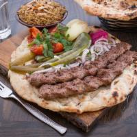 Kofta Kebab Plate (Traditional Iraqi Kebab) · 2 skewers of minced lean lamb and veal meat cooked on the grill. Served with grilled tomatoe...