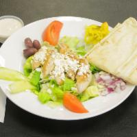 Greek Style Chicken Salad · Our garden salad with grilled chicken, feta, Kalamata olives and banana peppers.
