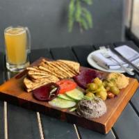Hummus Trio · White bean hummus with lemon and olive oil, smoked red beet dip, white bean hummus with gril...
