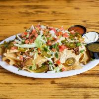 Nachos · Chicken, beef, BBQ pulled pork or black beans atop tortilla chips with queso, pico de gallo,...
