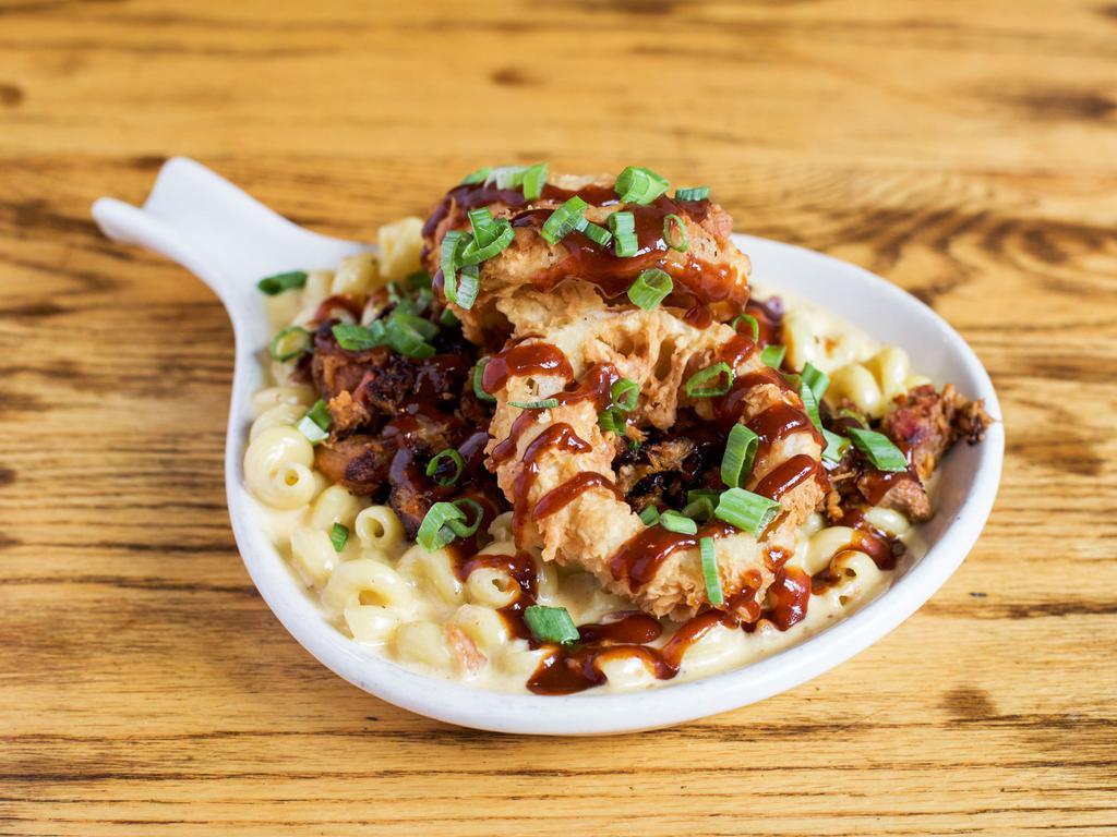 Pig Butt Mac 'N' Cheese · Slow-roasted, smoked BBQ pulled pork with green onion and flash-fried onion strings.