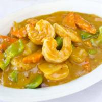 Curry Shrimp · Hot. Shrimp stir fried with bell peppers, carrots and onions in an imported coconut milk cur...