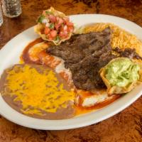 Tampiquena · Carne asada (charbroiled steak) and a cheese enchilada served with beans, rice, guacamole an...