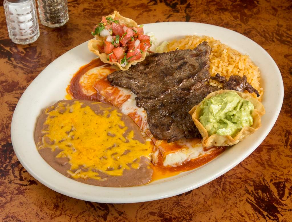 Tampiquena · Carne asada (charbroiled steak) and a cheese enchilada served with beans, rice, guacamole and salsa fresca.